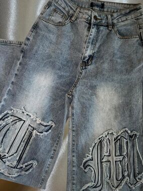 Men's Distressed Light Blue Denim Jeans with Embroidered Patch Details